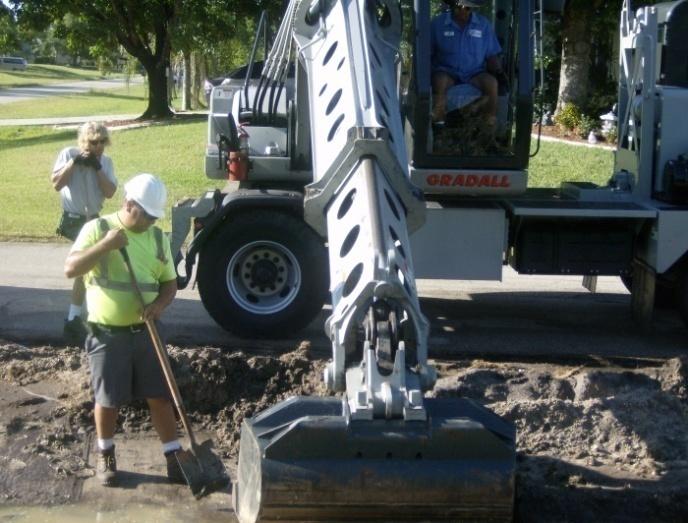 Workers Performing Swale Restoration